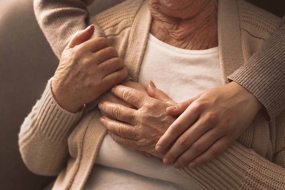 Family member hugging resident